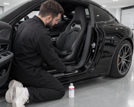 Daniel checks a shiny leather seat bolster — shown in the article “Leather seat care before winter: how to prevent cracks”